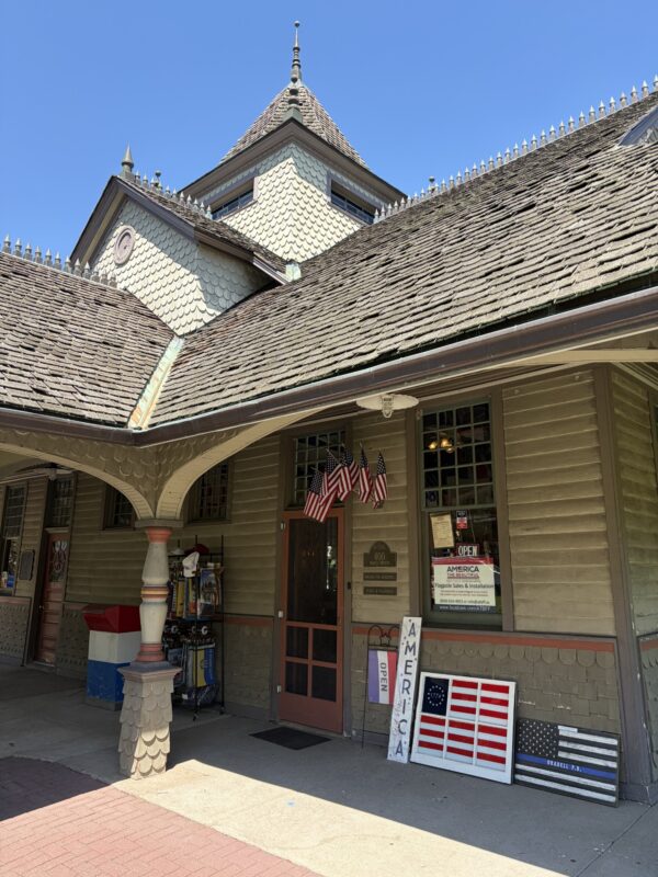 Entrance to America The Beautiful Flags & Flagpoles inside the historic Oradell Train Station in Oradell, NJ