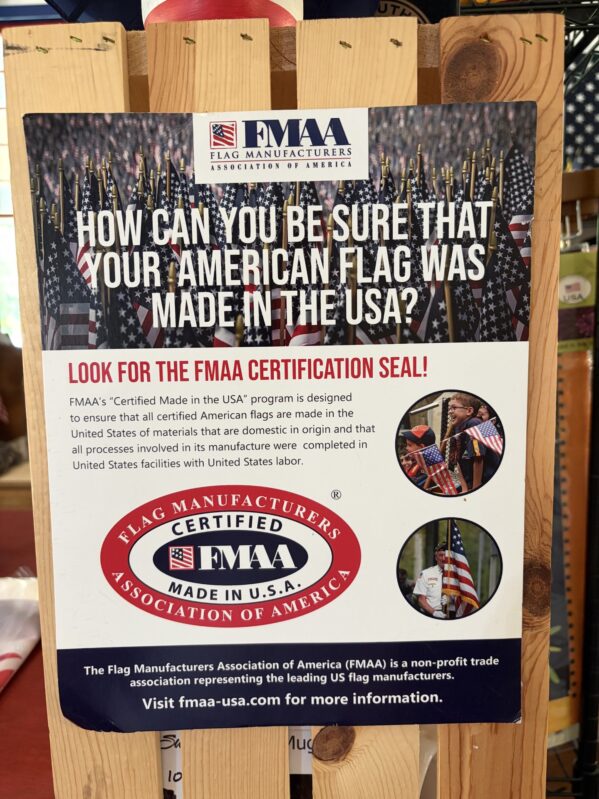 FMAA Sign at America The Beautiful Flags & Flagpoles FMAA sign displayed inside America The Beautiful Flags & Flagpoles, a specialty flag store offering American flags, flagpoles, and patriotic products.