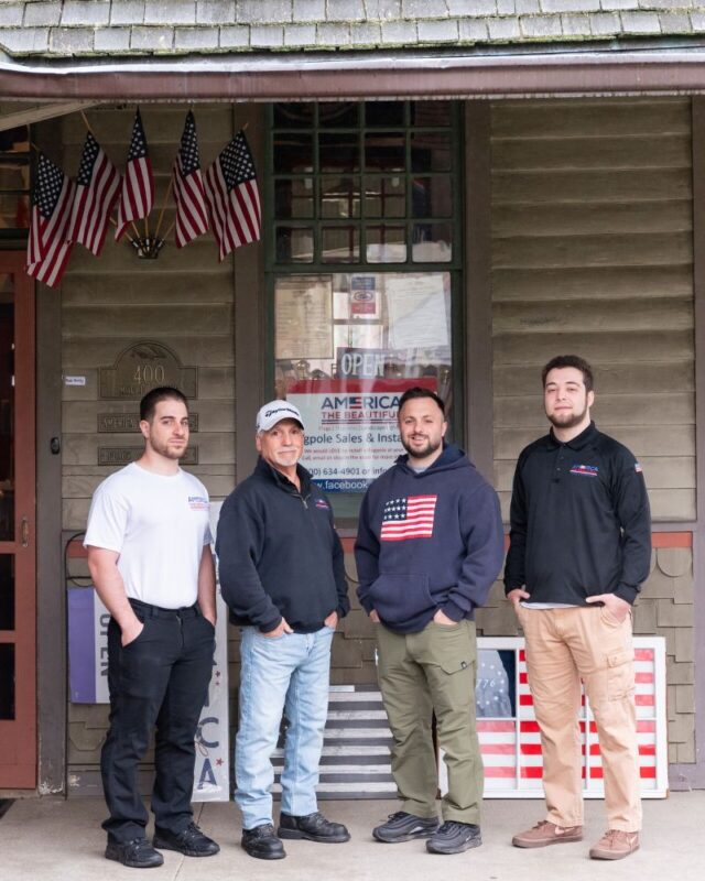 America the Beautiful Flags & Flagpoles Crew Outside Retail Store America the Beautiful Flags & Flagpoles crew outside retail store